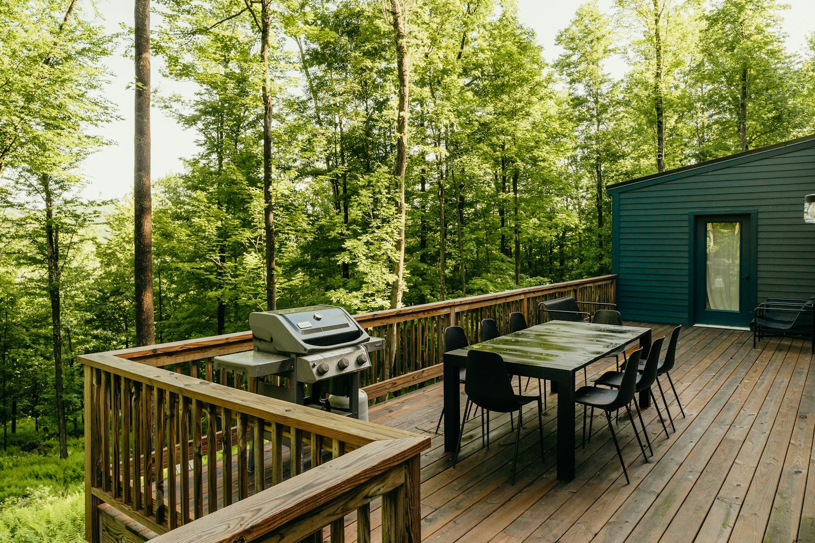 Cozy wooden outdoor deck with table and chairs